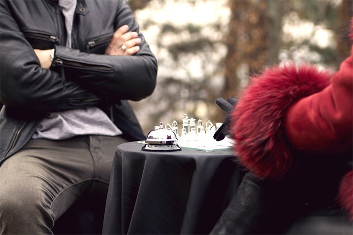 man and woman playing chess, board game, chess