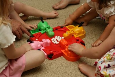 Kids playing Hungry Hungry Hippos