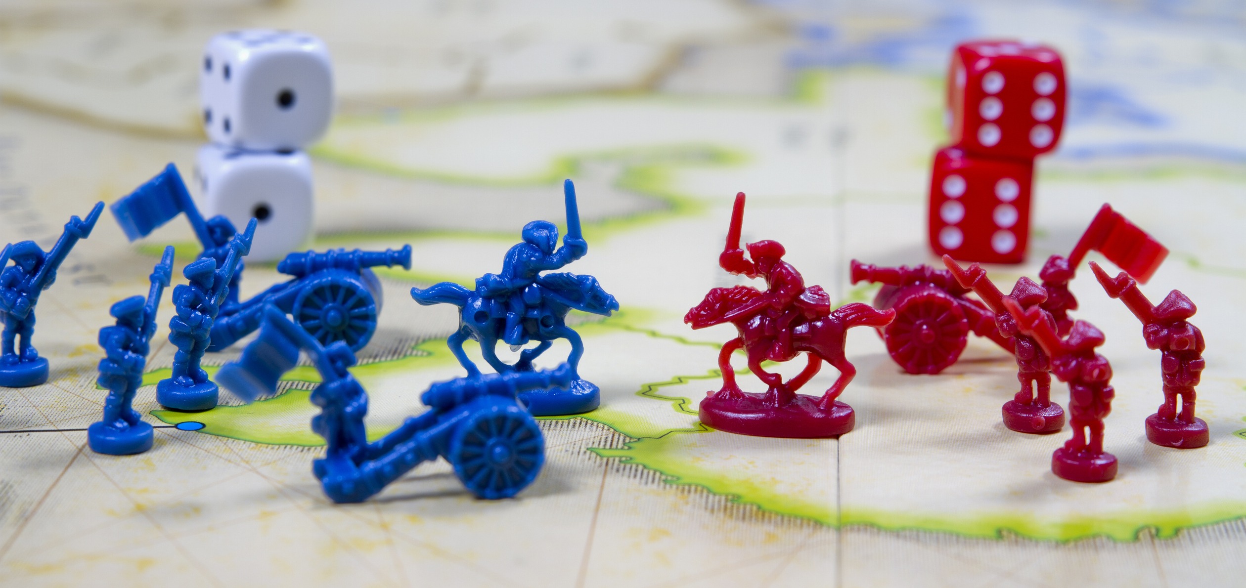 blue and red armies on a Risk board game
