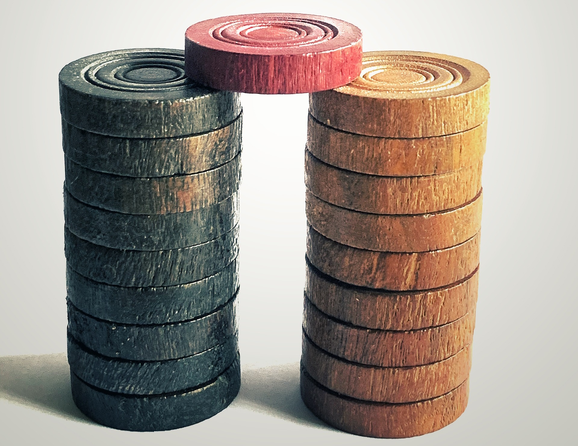 Brown wooden barrels on white surface