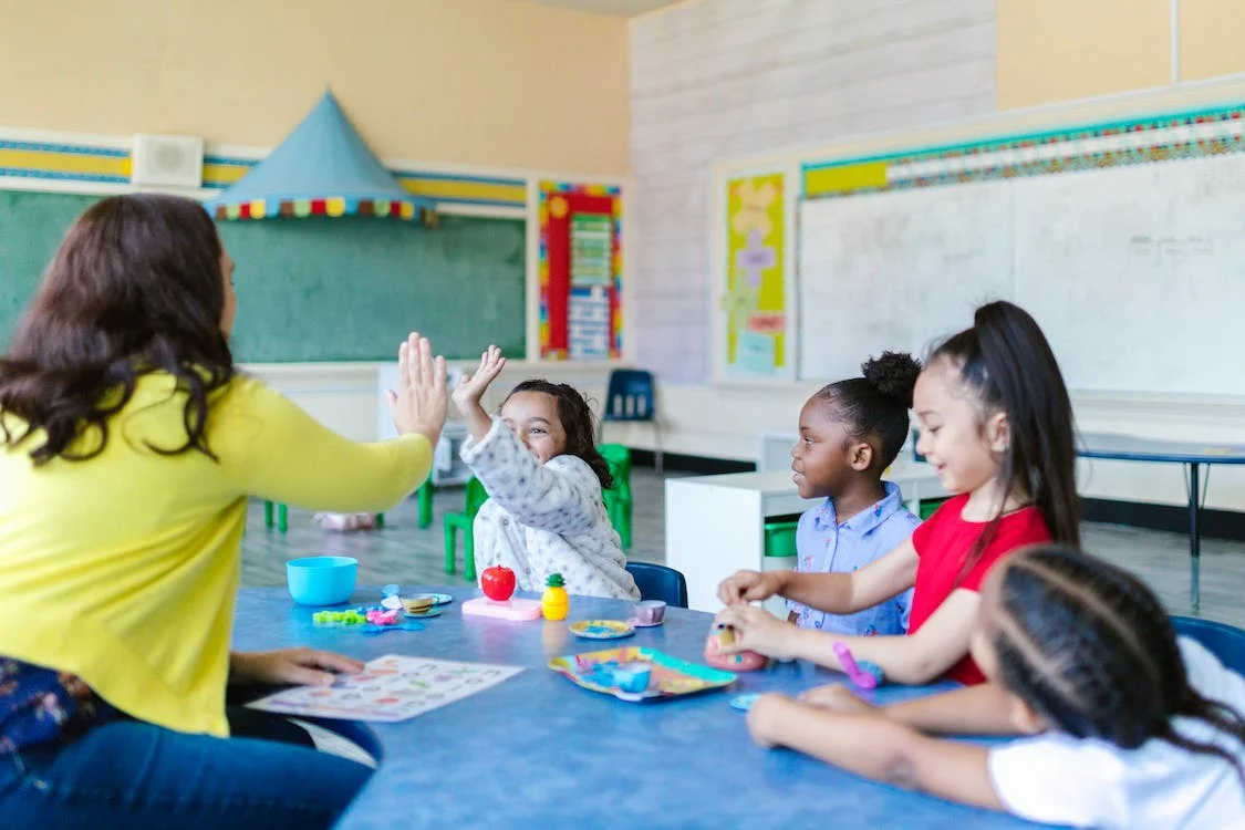 Kids and Teacher Playing
