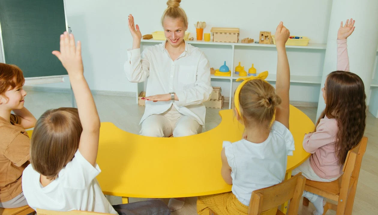 Teacher showing a hand gesture