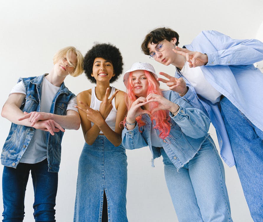 Young adult showing different hand signals