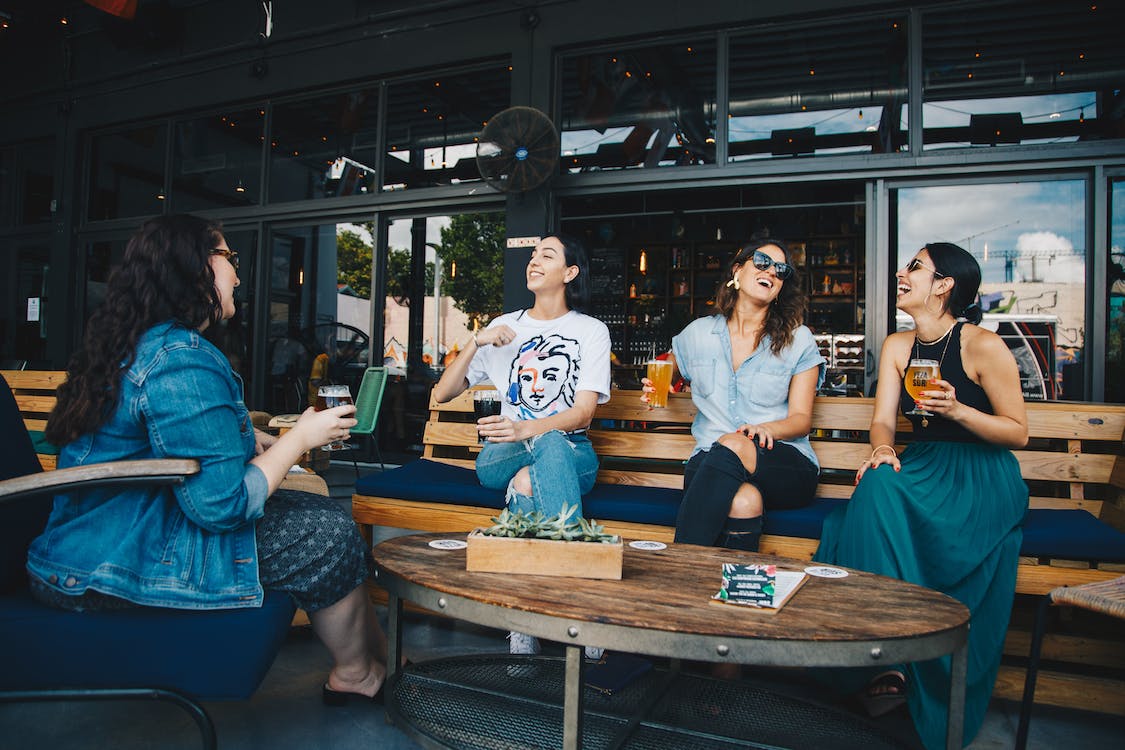 Four women chatting while sitting