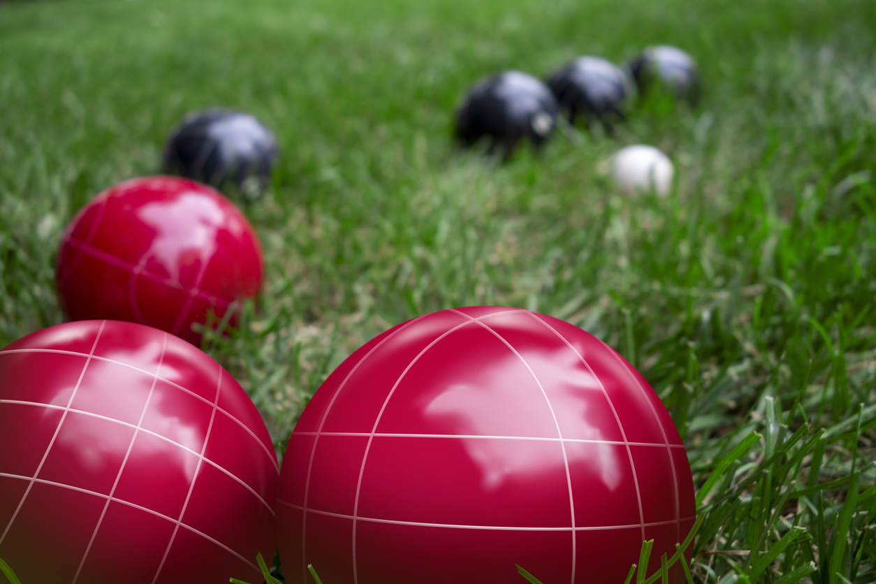 bocce balls on green lawn