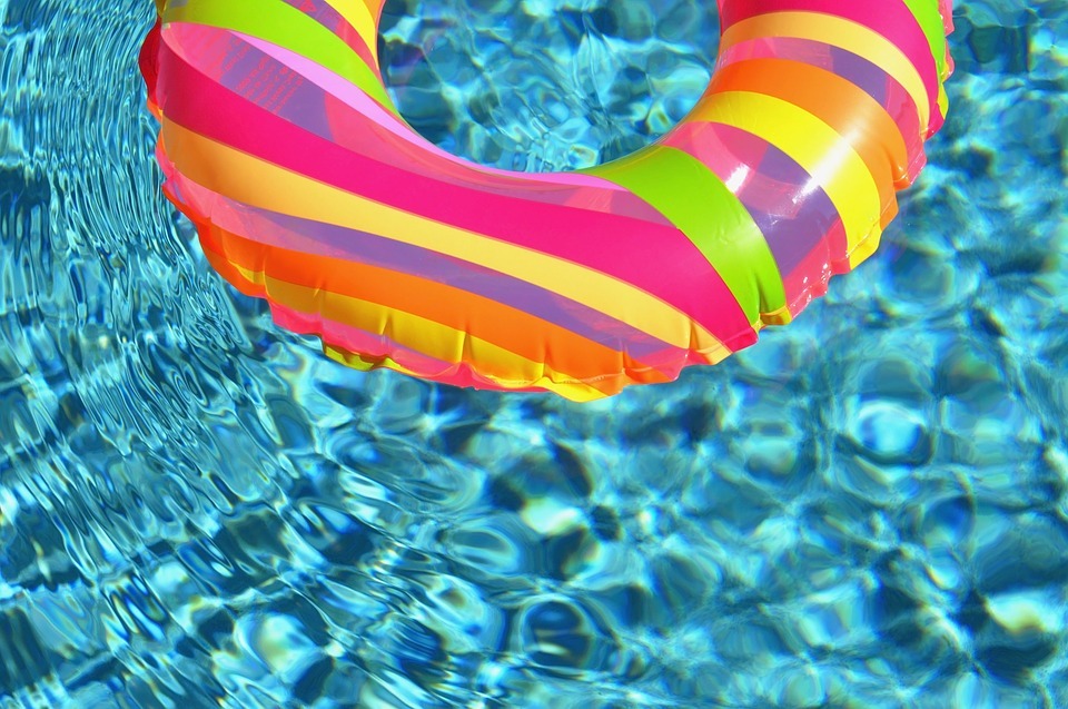 pool water, rainbow-colored pool float