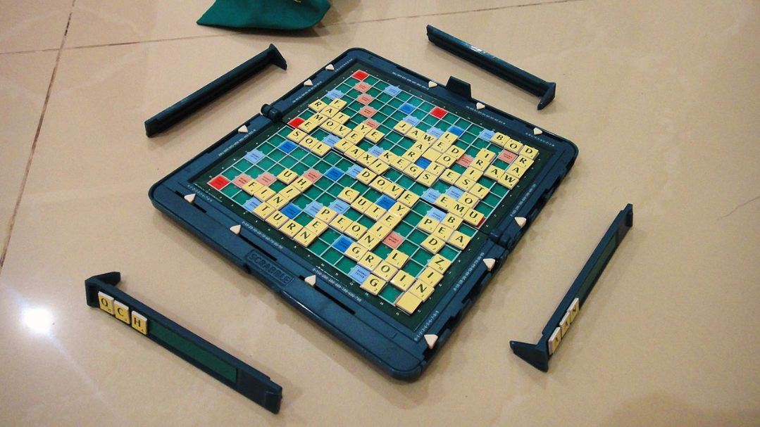 a near-ending game board, tiles and racks of the magnetic Pocket Scrabble