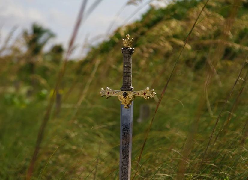 medieval sword, grass