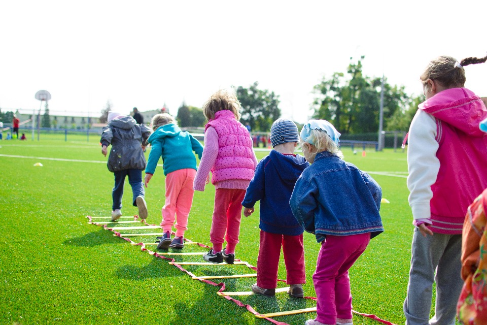 Children playing in the flied lined up