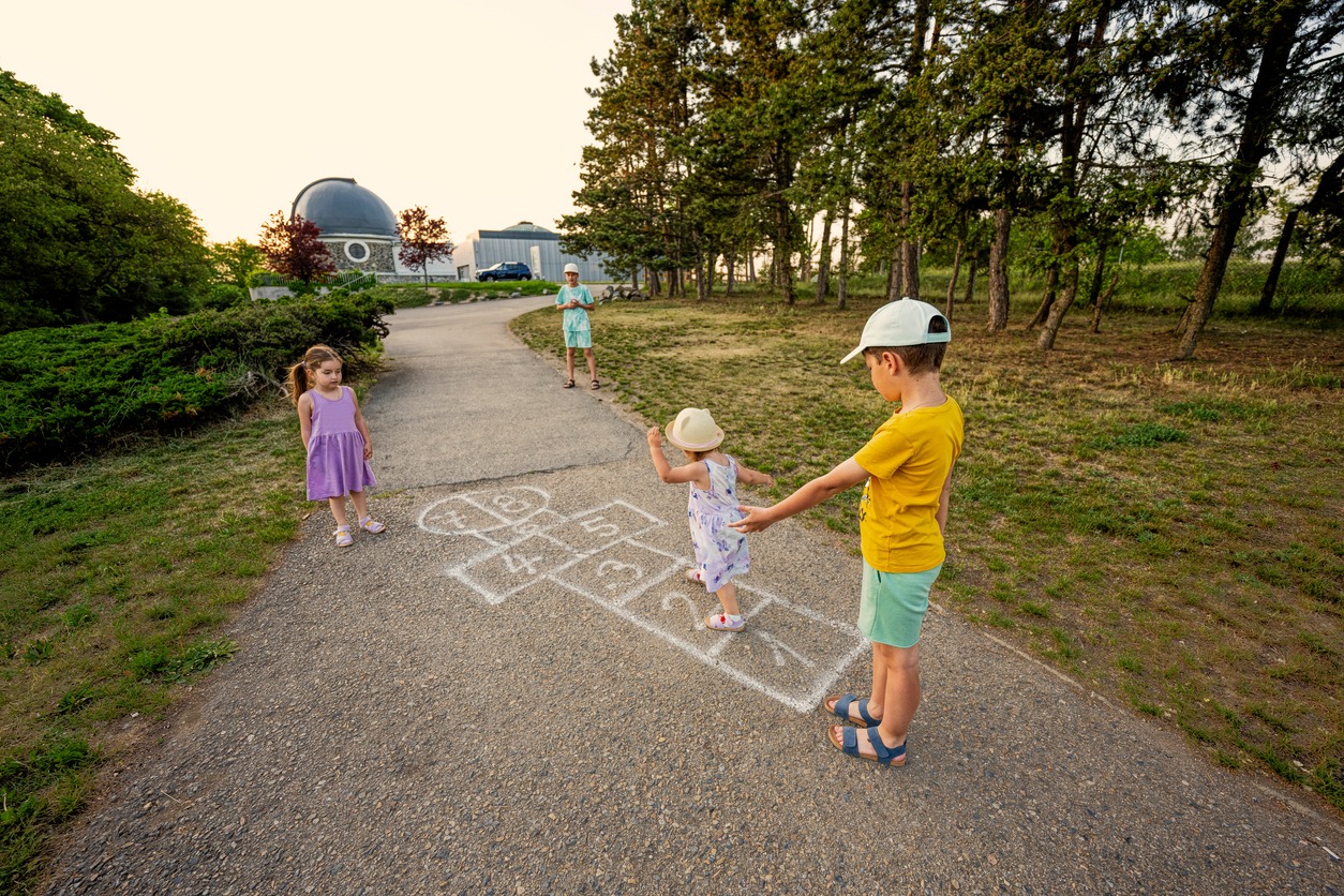 kids playing hopscotch in the park