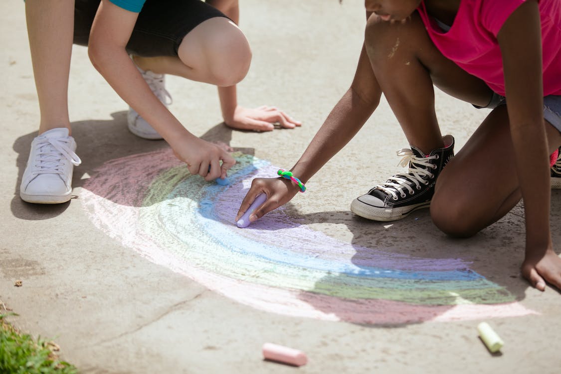 Kids Drawing a Rainbow in the Ground using Chalk